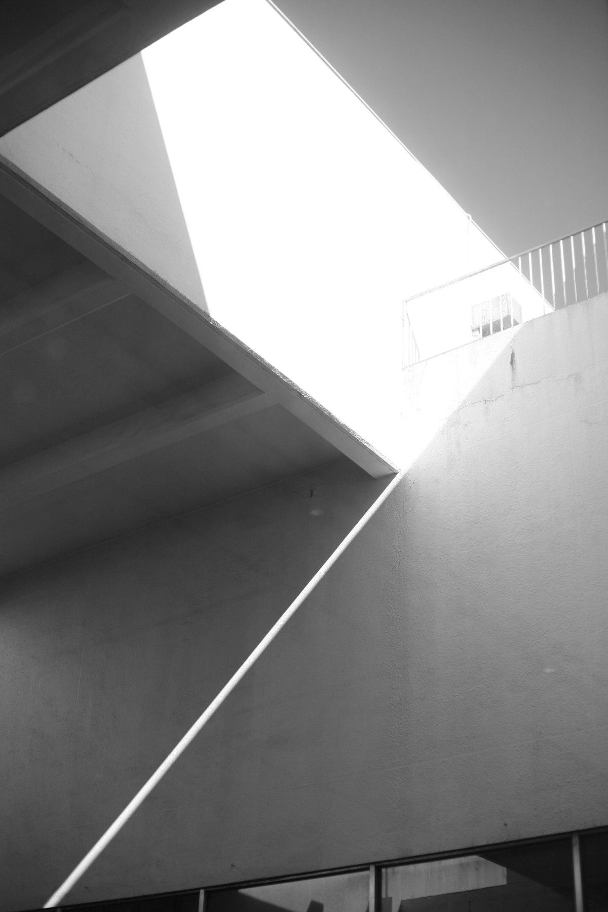 Atmospheric light cutting through a dark room.